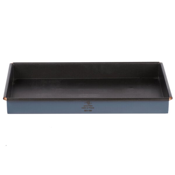 A rectangular black non-stick cake pan.