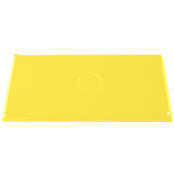 A yellow rectangular Tablecraft cast aluminum cooling platter.