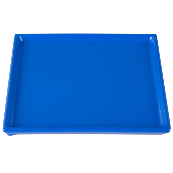 A cobalt blue rectangular cast aluminum cooling platter.