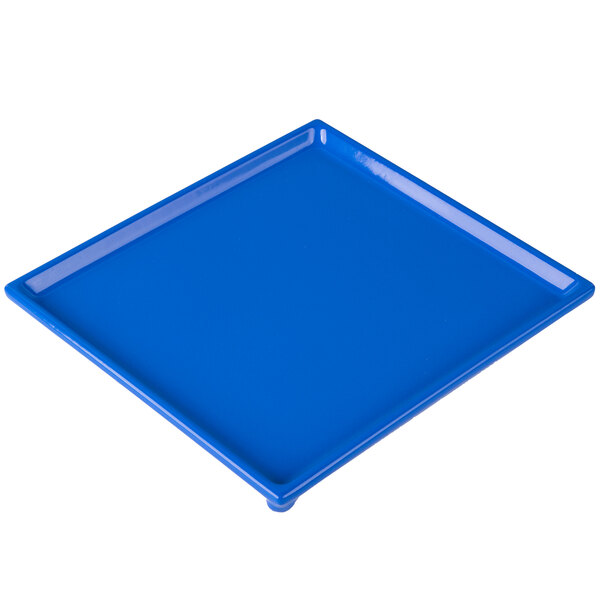 A cobalt blue cast aluminum rectangular cooling platter with a square shape.