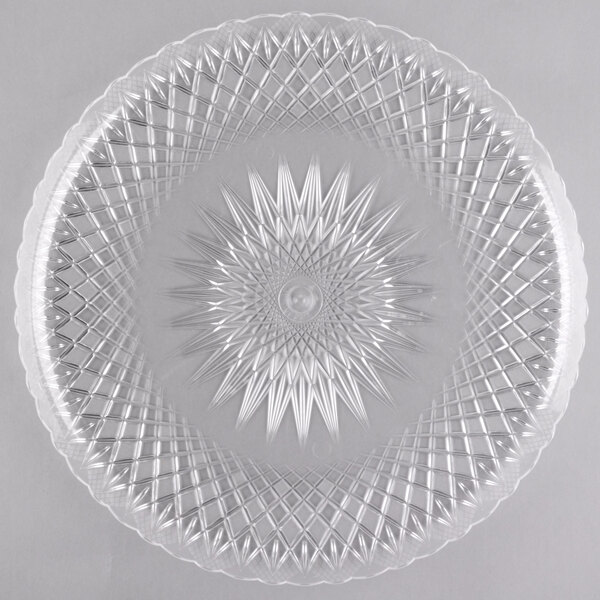 A clear plastic Fineline scalloped catering tray.