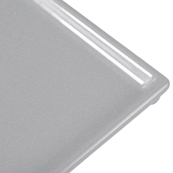 A Tablecraft natural cast aluminum rectangular cooling platter with a white background.