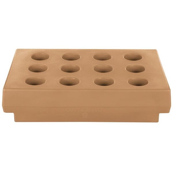 A brown rectangular Cambro cutlery rack with eight holes.