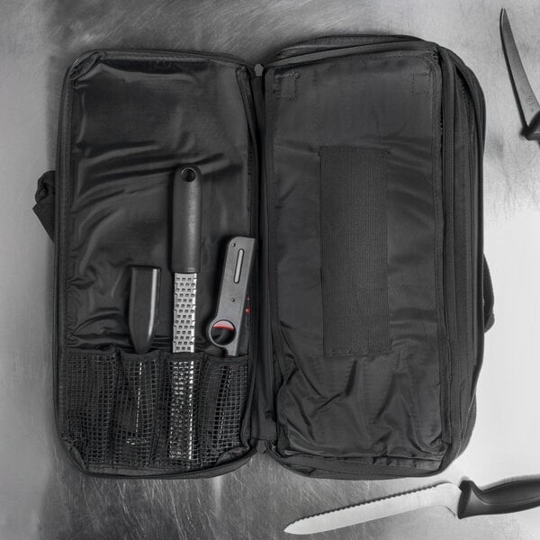 A Dexter-Russell black cutlery case with tools inside.