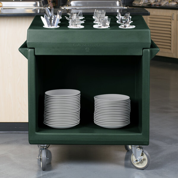 A Cambro granite green tray and dish cart with plates and silverware on it.