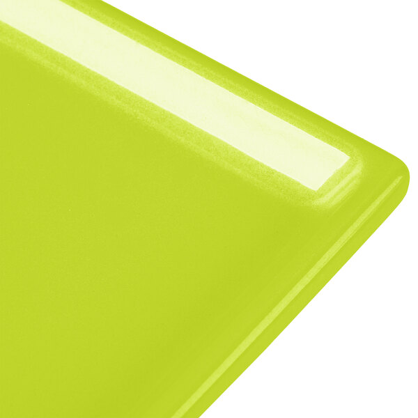 A lime green Tablecraft cast aluminum rectangular cooling tray.