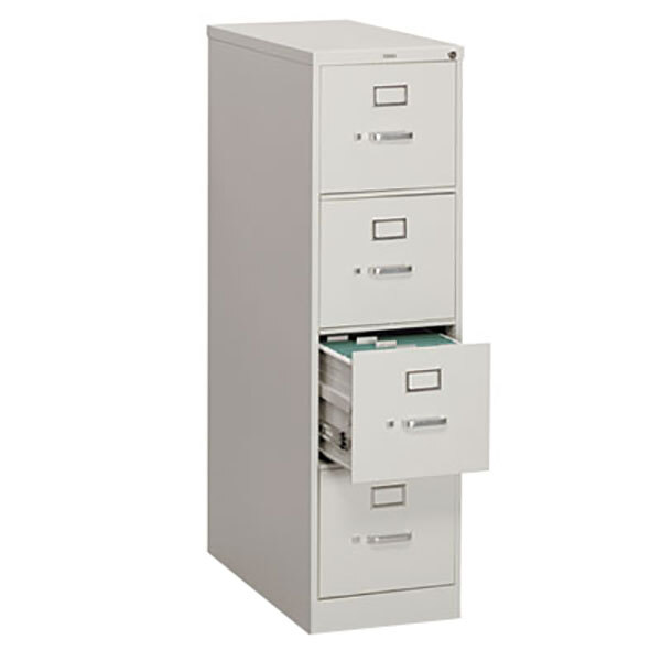 A light gray HON filing cabinet with four drawers, one open.