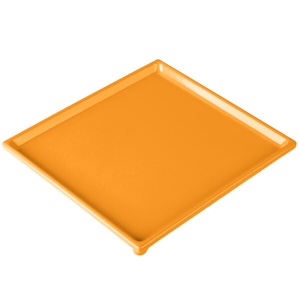 An orange rectangular cast aluminum cooling platter.