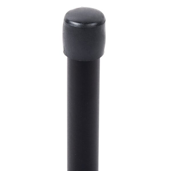 A black powder coated iron cylinder with a white top.