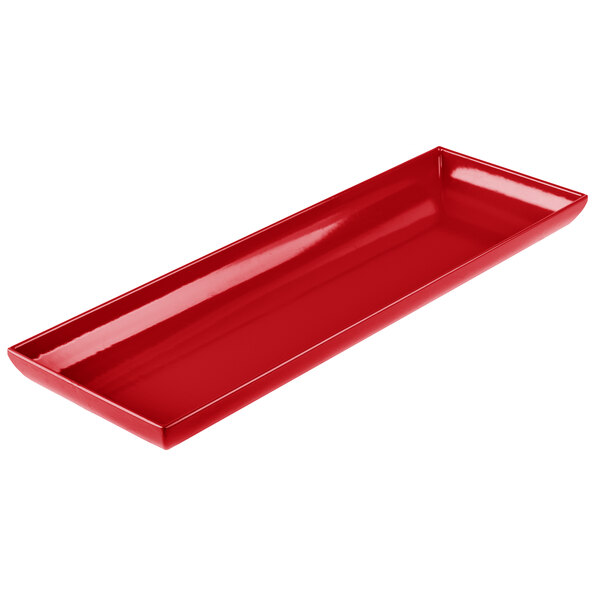 A red Tablecraft cast aluminum rectangular platter with a handle.