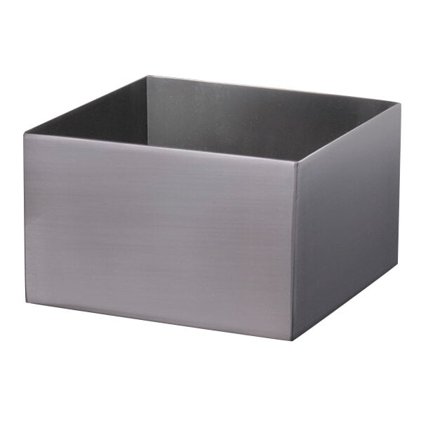 A Clipper Mill stainless steel square pan riser on a counter.