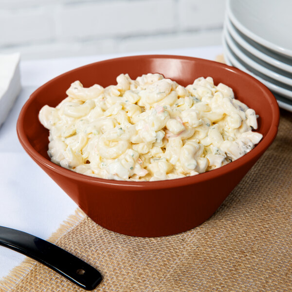 A Tablecraft copper serving bowl filled with macaroni and cheese.