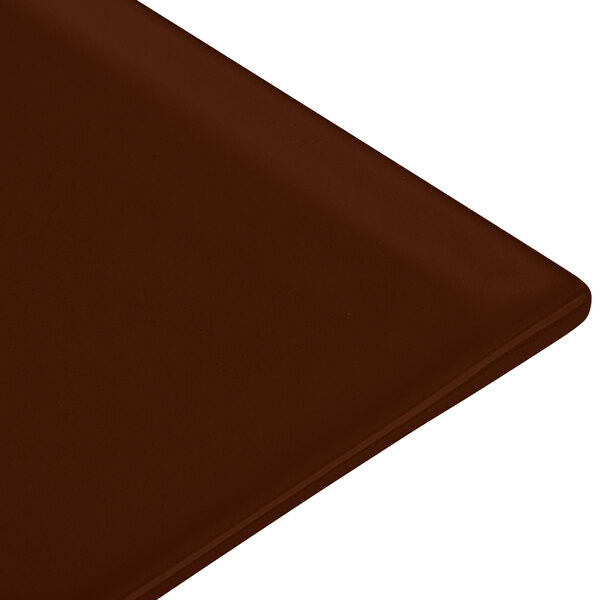 A brown cast aluminum rectangular cooling platter with a brown surface.