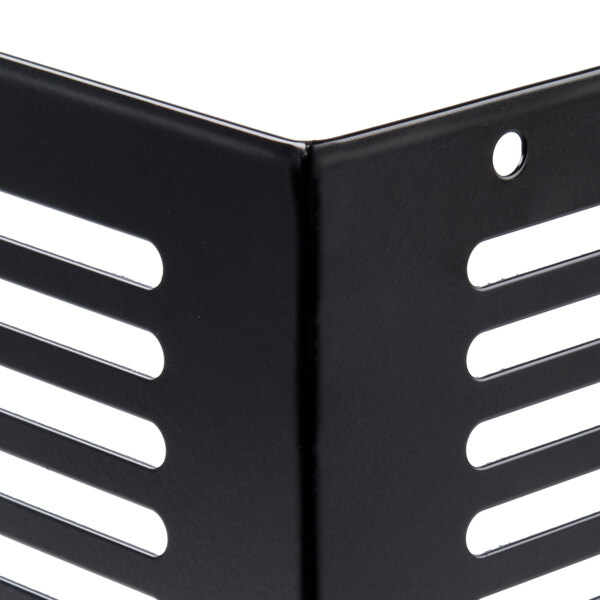 A black metal Avantco narrow depth grille with holes in it.