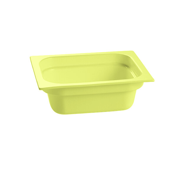 A lime green cast aluminum food pan with a white background.