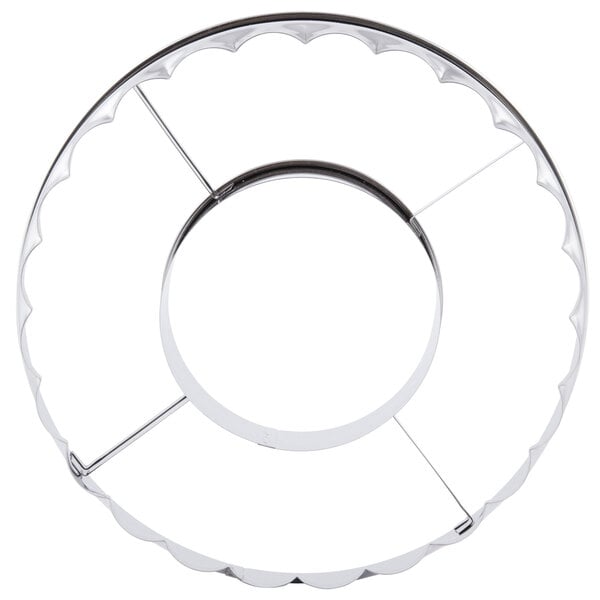 A stainless steel circular metal cutter with a ring around it.