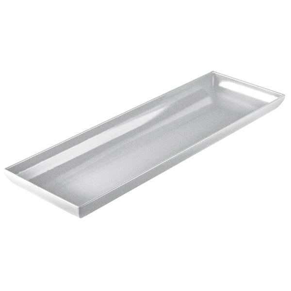 A natural cast aluminum rectangular platter with a flared edge.