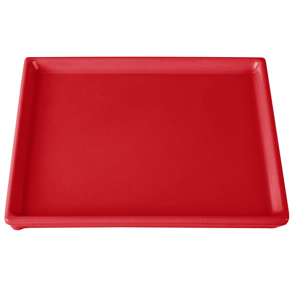 A red rectangular Tablecraft cooling platter with a white surface.