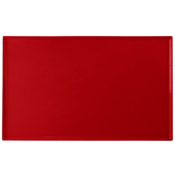 A red rectangular cast aluminum cooling platter.