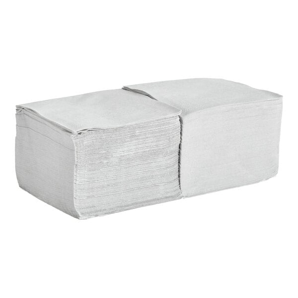 A stack of silver or gray 2-ply beverage or cocktail napkins.