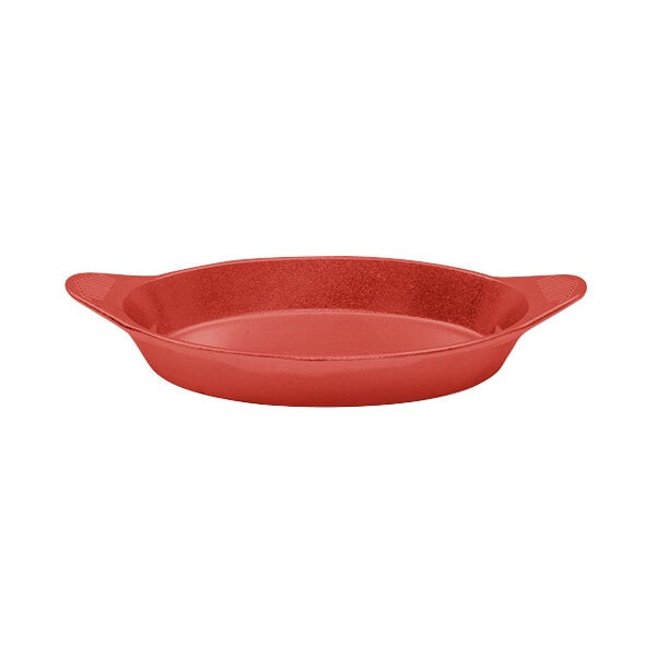 A red cast aluminum pan with two shell-shaped handles.