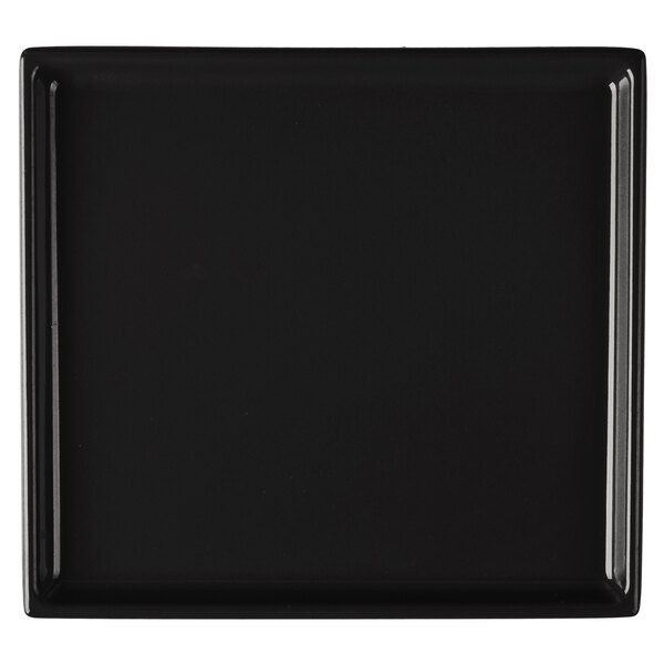 A black rectangular cast aluminum cooling platter with a white background.