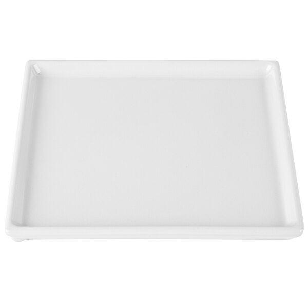 A white rectangular cast aluminum Tablecraft cooling platter with a small handle.