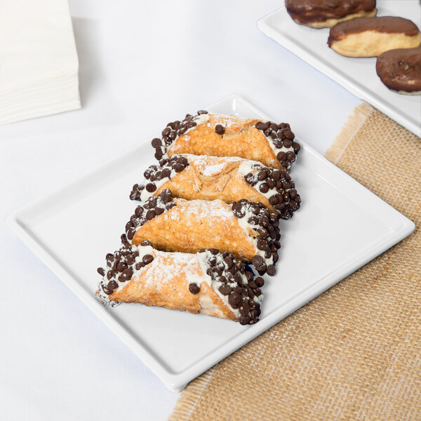 A white Tablecraft rectangular cooling platter with pastries on it.