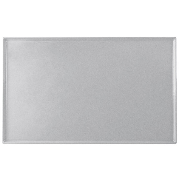 A natural cast aluminum rectangular cooling platter with a white border.