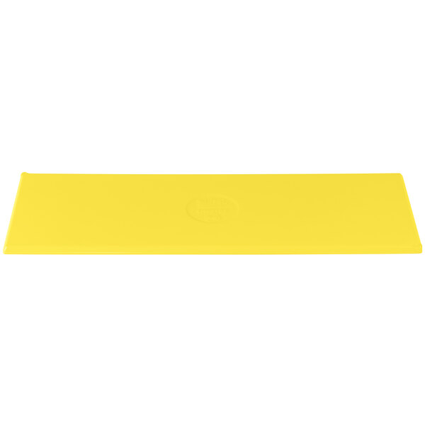 A yellow rectangular cast aluminum cooling platter with a logo on it.