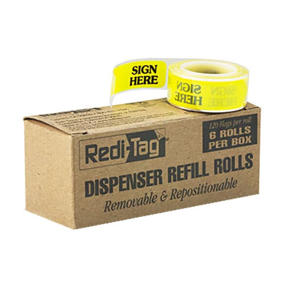 A cardboard box with a yellow label reading "Redi-Tag Yellow 'Sign Here' Arrow Page Flag Refill" containing rolls of yellow tape with black text.