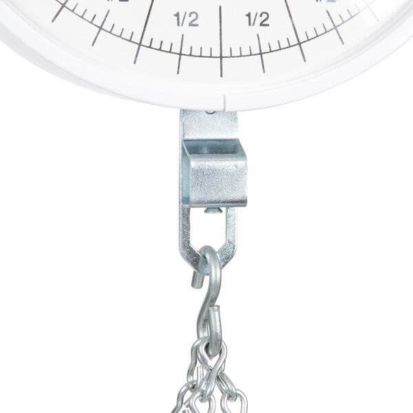 A white Cardinal Detecto hanging scale with a chain attached.