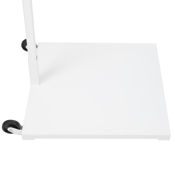 A white rectangular stand with black wheels.