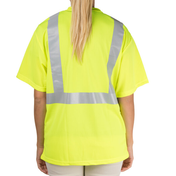 A person wearing a yellow Cordova safety shirt with reflective stripes.