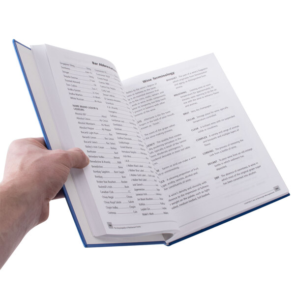 a hand holding a book