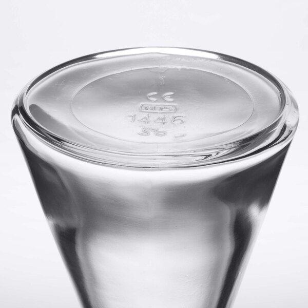 A Stolzle Pisa clear glass carafe with a lid.