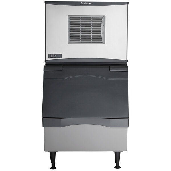 A large grey and black Scotsman air cooled ice machine.