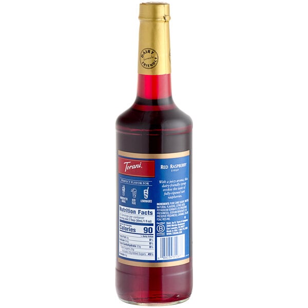 A Torani Red Raspberry Flavoring Syrup bottle with a label on it.