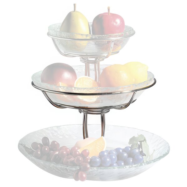 A Clipper Mill stainless steel three tiered stand with fruit including grapes and a lemon.