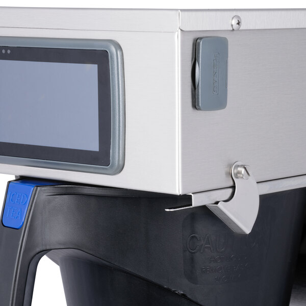 A Curtis G4RTB tea brewer with a digital display on it.