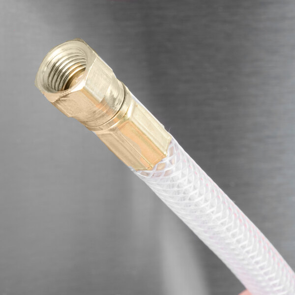 A close-up of a Curtis G4RTB brew basket hose with a gold handle.