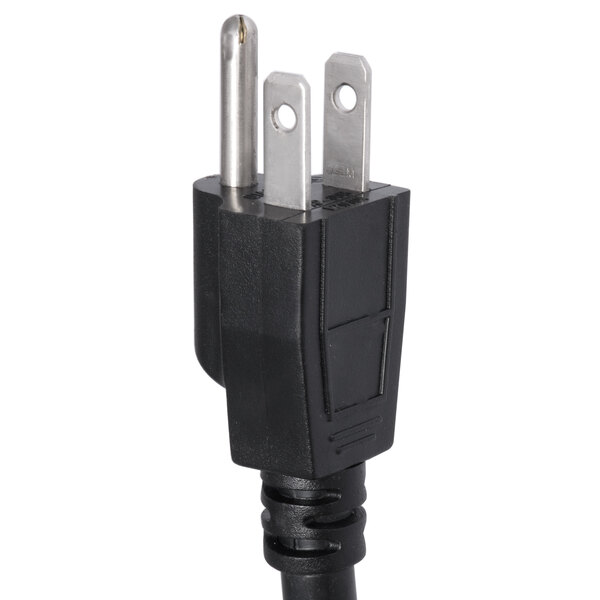 A black electrical plug with three holes.