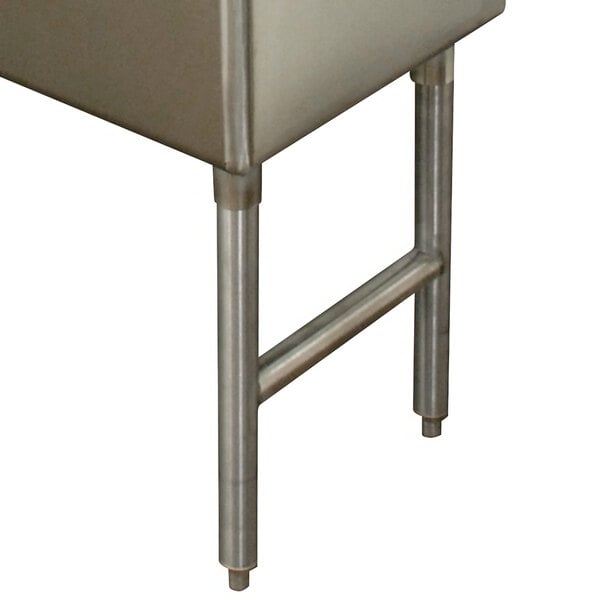 A stainless steel Advance Tabco sink with metal legs.