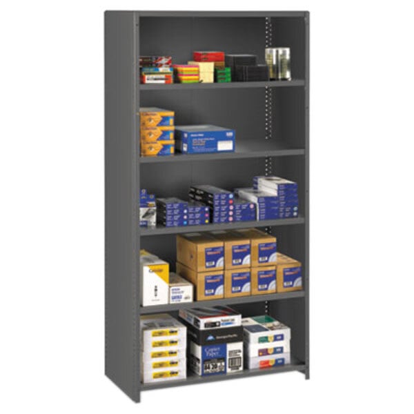 A Tennsco medium gray commercial steel shelving unit with five shelves holding boxes and papers.