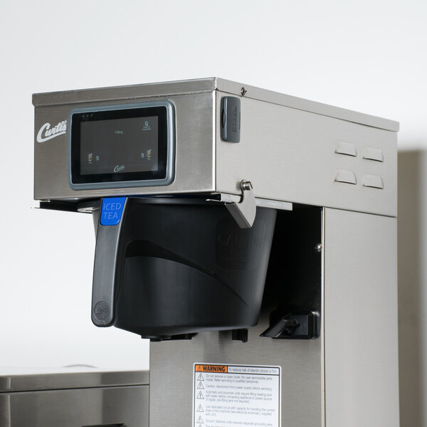 A Curtis G4RSTB sweet tea brewer machine with a black rotating container.