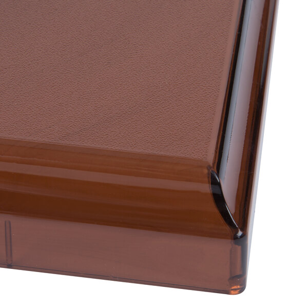 A brown square Vollrath Straw Boss dispenser lid.