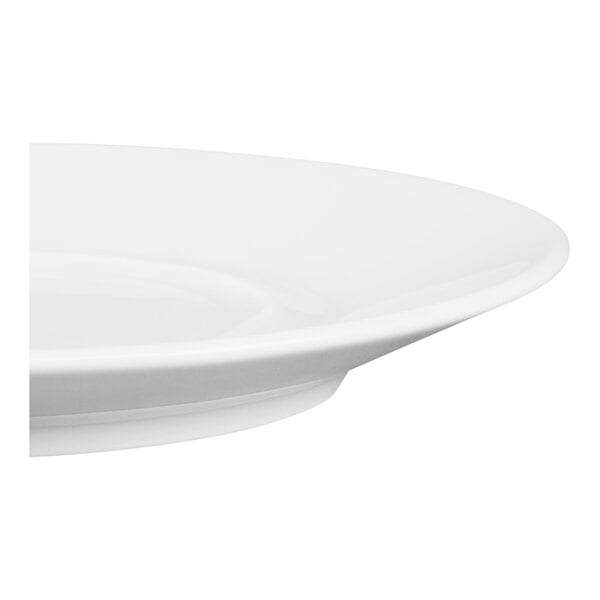 A close-up view of a white, round porcelain saucer with a smooth, glossy finish.