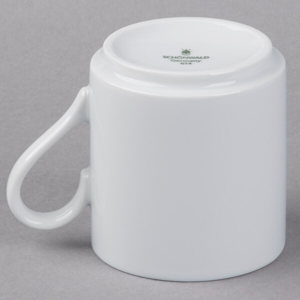 A Schonwald white porcelain mug with a handle.