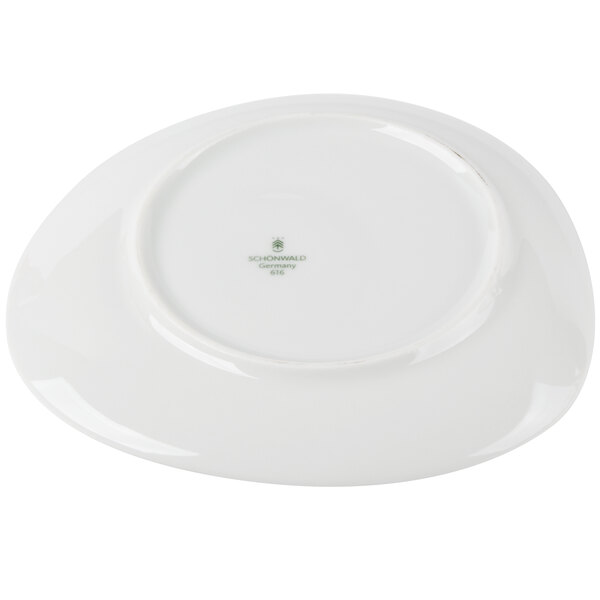 A close-up of a light gray Schonwald porcelain saucer.