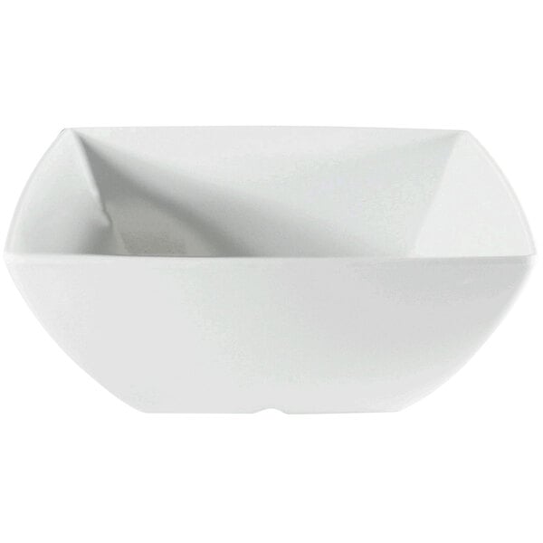 A close-up of a white Thunder Group square melamine bowl.